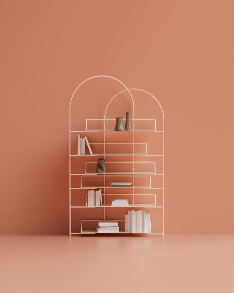 LateB Bookshelf a design Enrico Girotti -Two arches enclose and highlight stacks of books gently suspended from a sinuous and sturdy structure. LateB is a sculptural metal bookshelf, which can be realized with shelves in marble, HPL or metal.